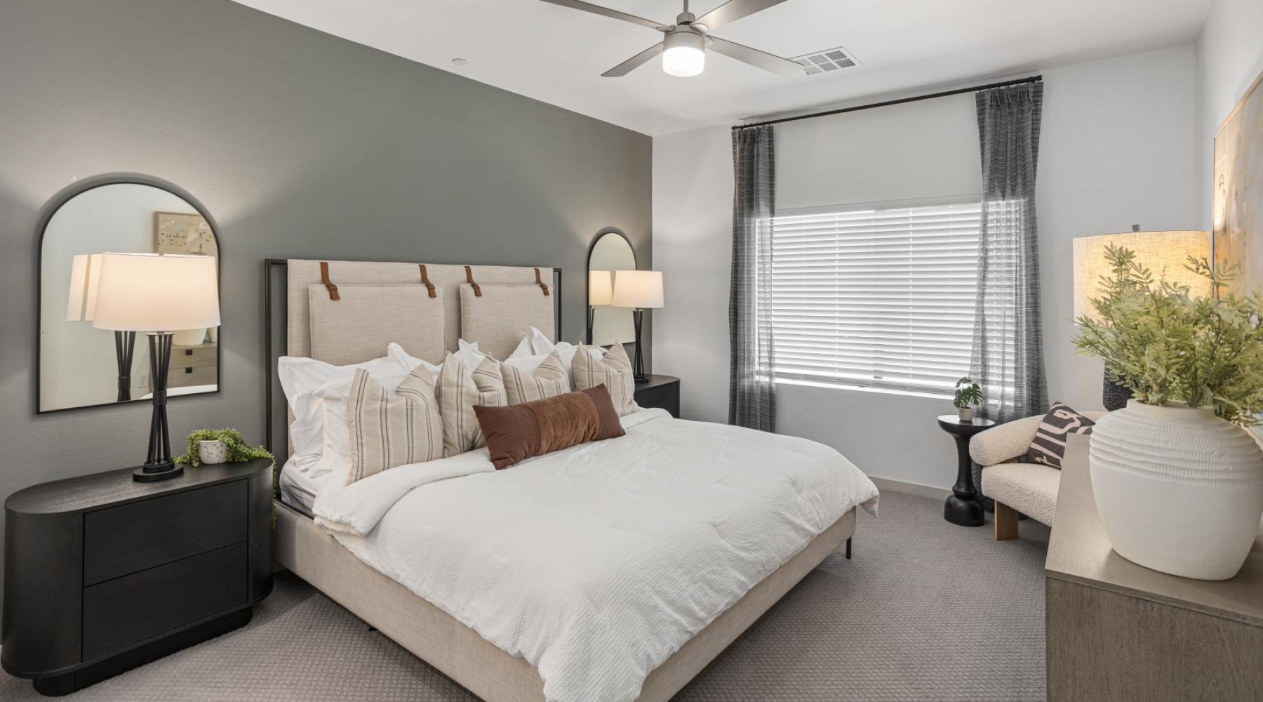 a bedroom with a large bed and a window